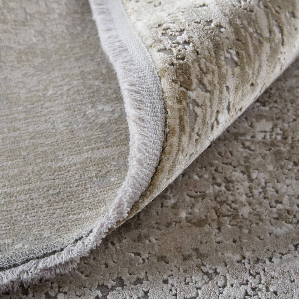 3' X 5' Taupe Ivory And Gold Abstract Power Loom Distressed Area Rug With Fringe