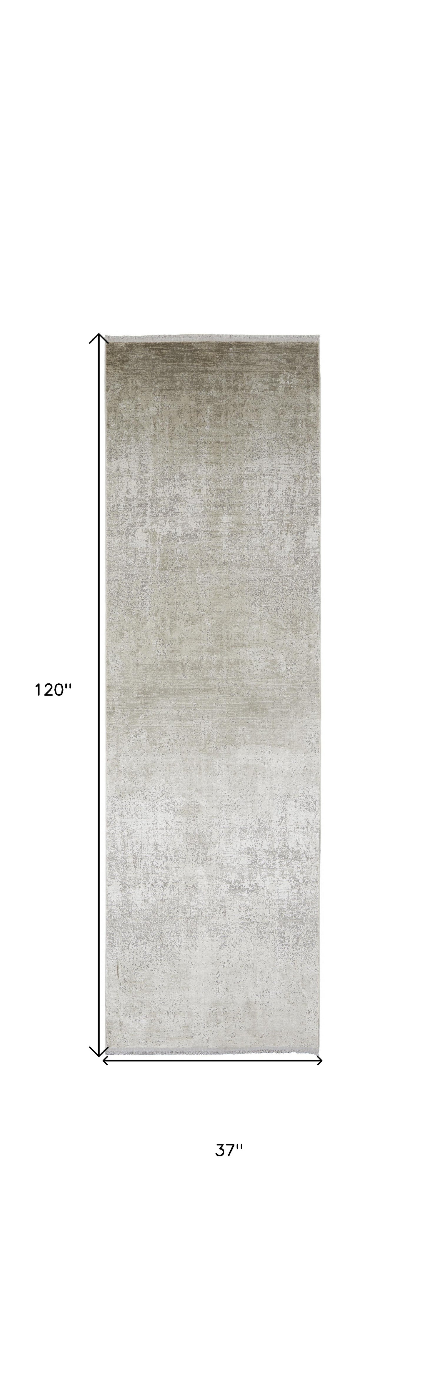 3' X 5' Taupe Ivory And Gold Abstract Power Loom Distressed Area Rug With Fringe