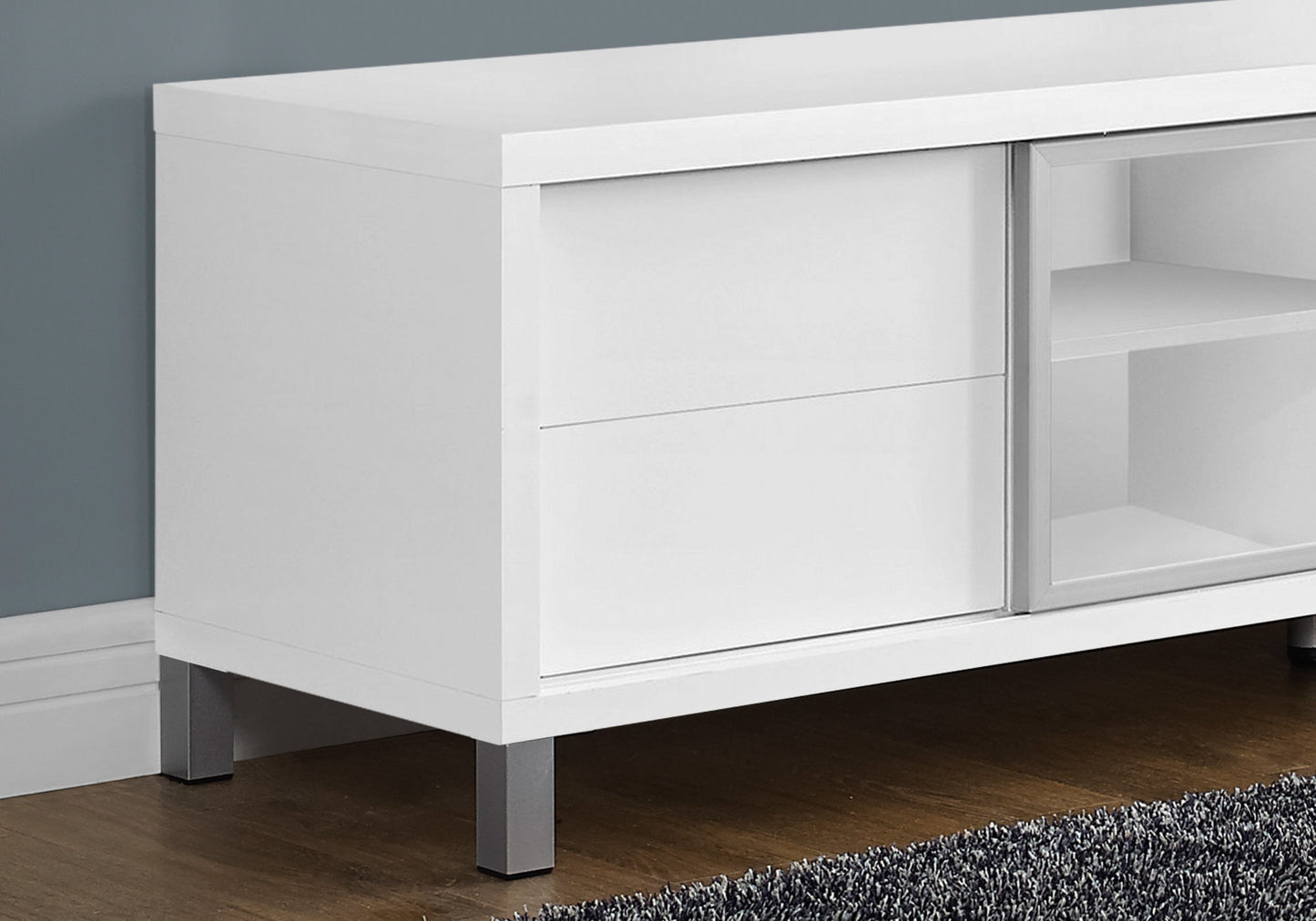 17.75" X 71" X 19.75" White Clear Silver Particle Board Glass Hollow Core TV Stand
