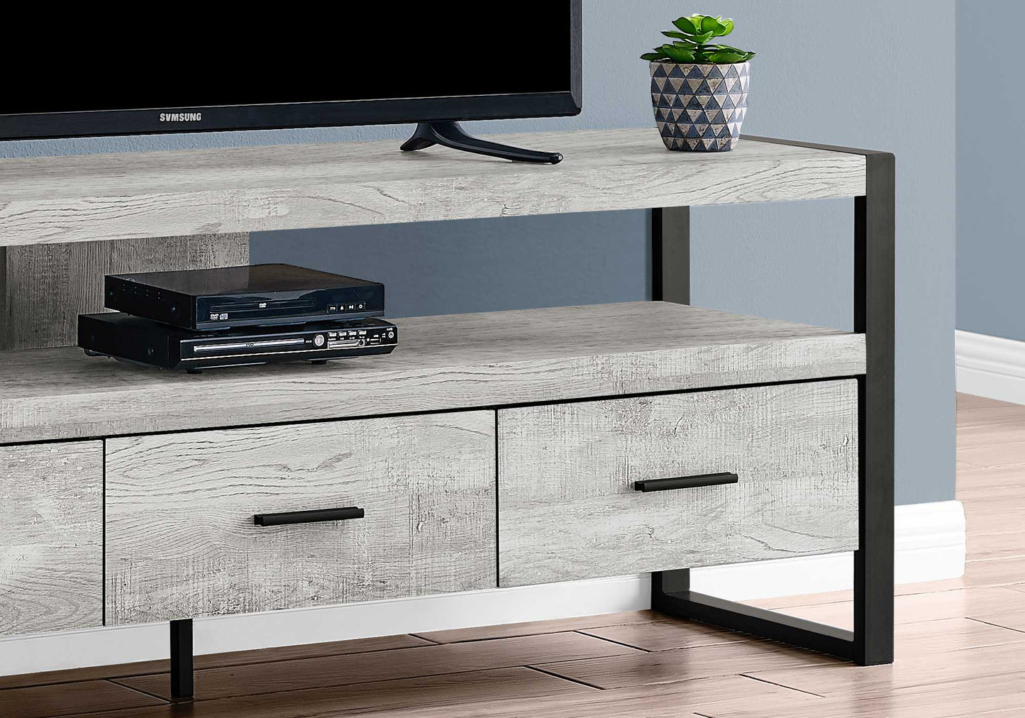 15.5" X 59" X 21.75" Taupe Black Particle Board Hollow Core Metal TV Stand With 3 Drawers