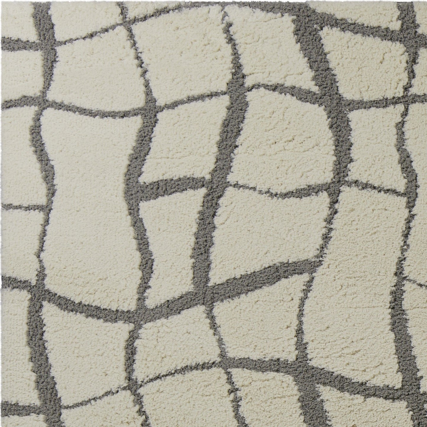 5'X7' Ivory Machine Woven Abstract Indoor Shag Rug