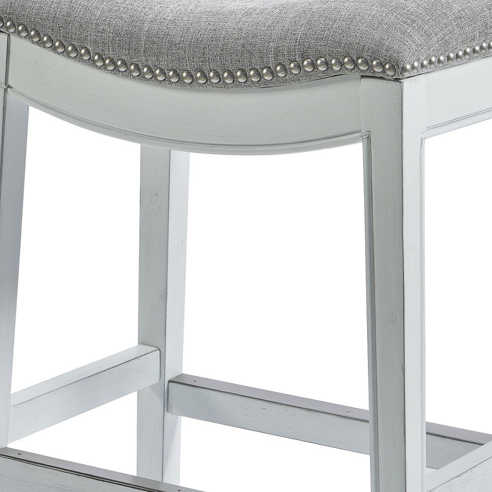 Counter Height Saddle Style Counter Stool With Grey Fabric And Nail Head Trim