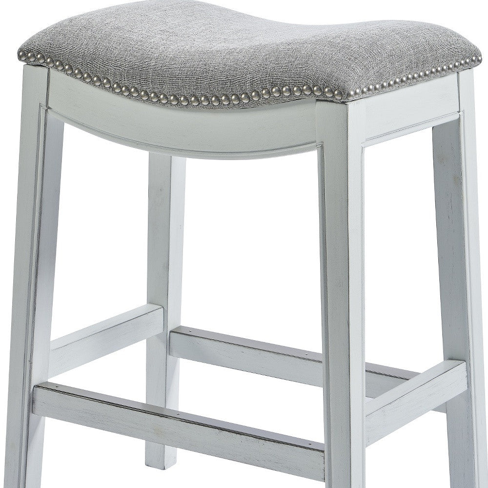 Counter Height Saddle Style Counter Stool With Grey Fabric And Nail Head Trim