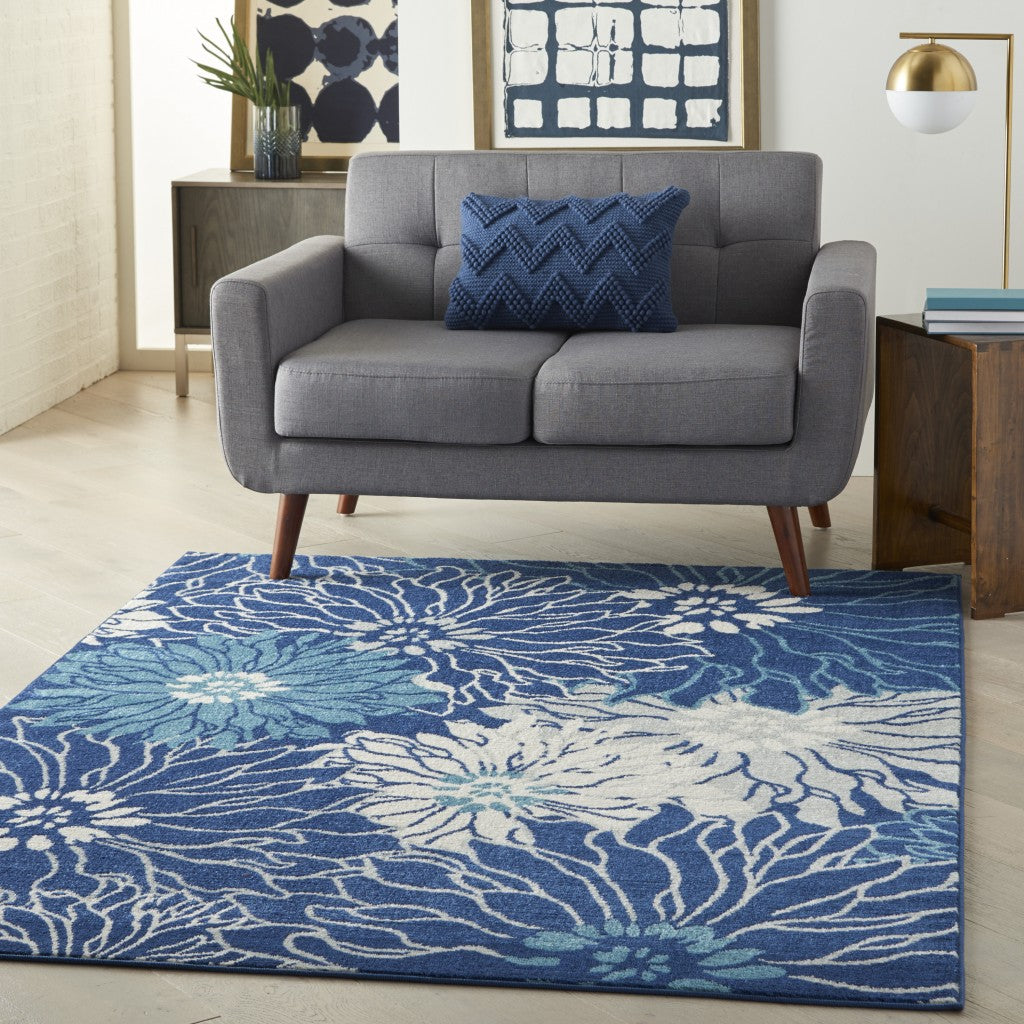 5' Blue And Ivory Round Floral Dhurrie Area Rug