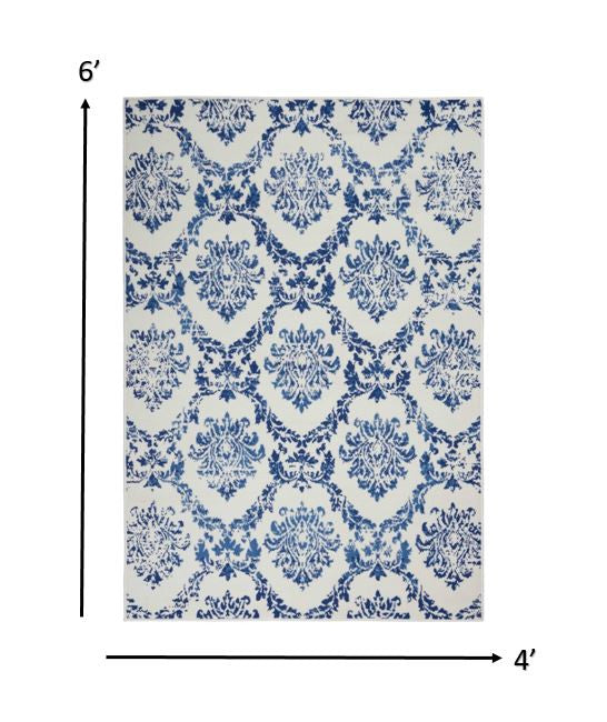 4' X 6' Blue And Ivory Floral Dhurrie Area Rug