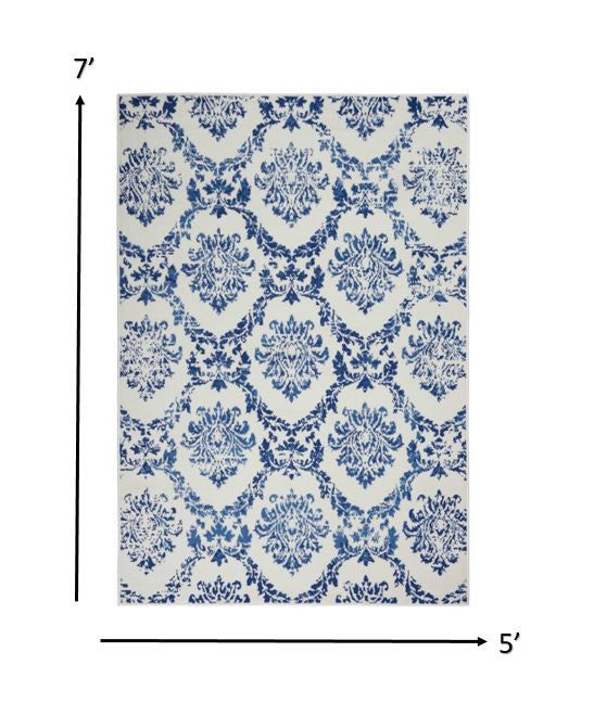 4' X 6' Blue And Ivory Floral Dhurrie Area Rug