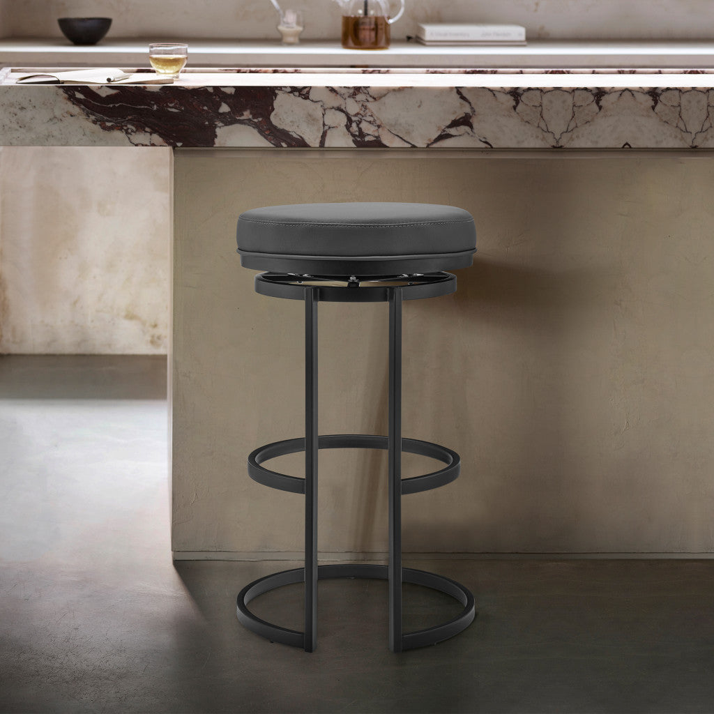 26" Gray and Black Faux Leather and Iron Swivel Backless Counter Height Bar Chair with Footrest