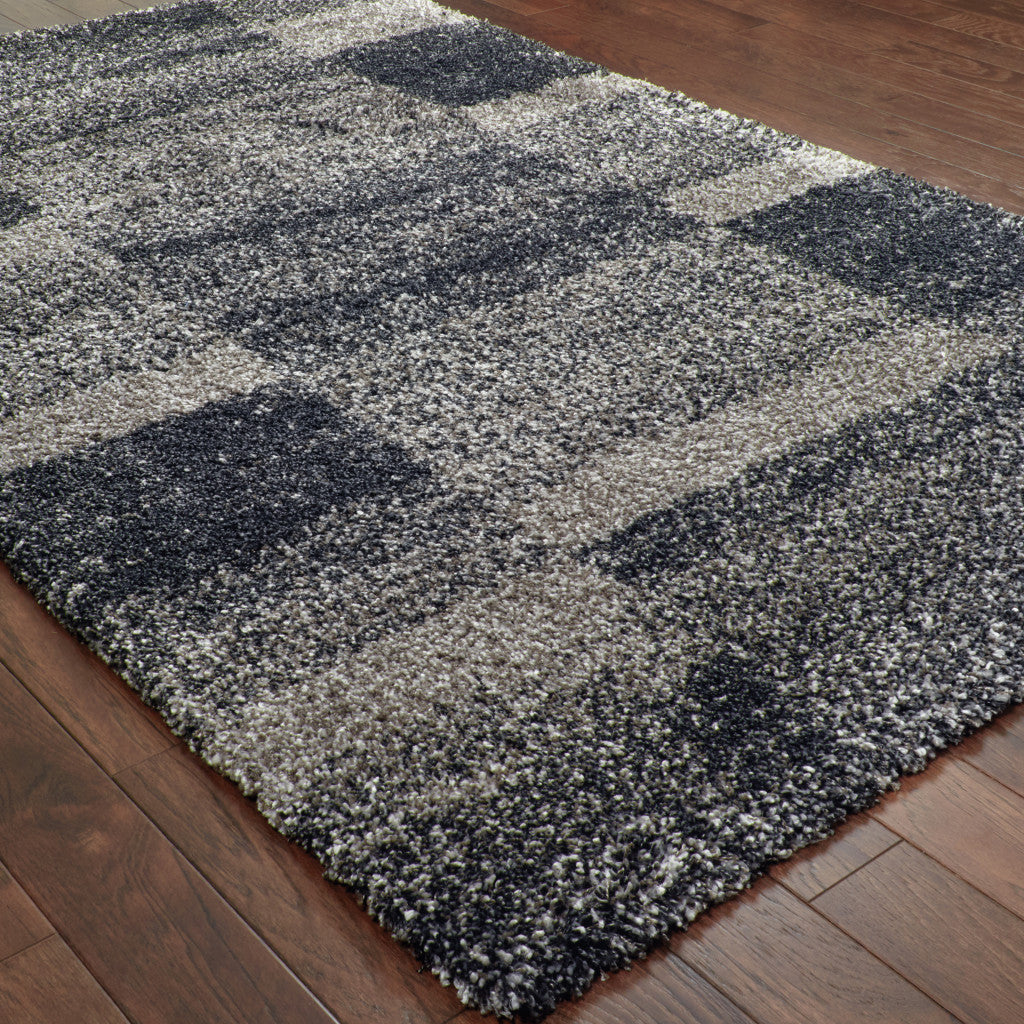 5' x 8' Black and Gray Geometric Shag Power Loom Area Rug