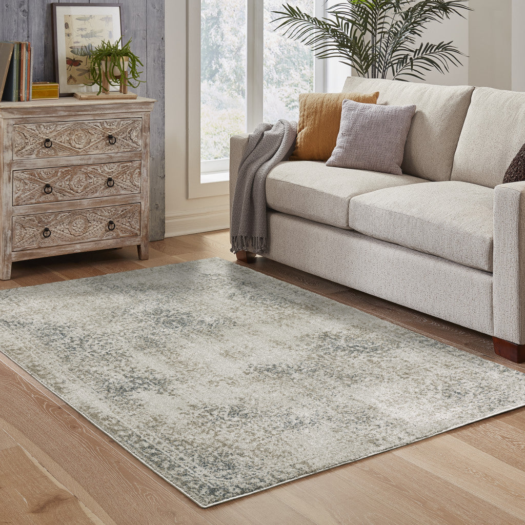 6' X 9' Grey Beige And Teal Oriental Power Loom Stain Resistant Area Rug