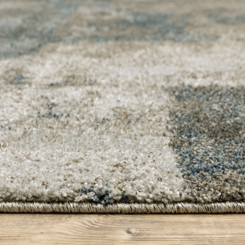 5' X 8' Teal Blue Grey Tan And Beige Geometric Power Loom Stain Resistant Area Rug