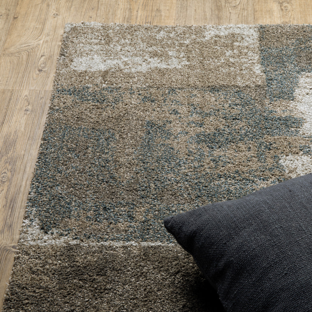 6' X 9' Teal Blue Grey Tan And Beige Geometric Power Loom Stain Resistant Area Rug