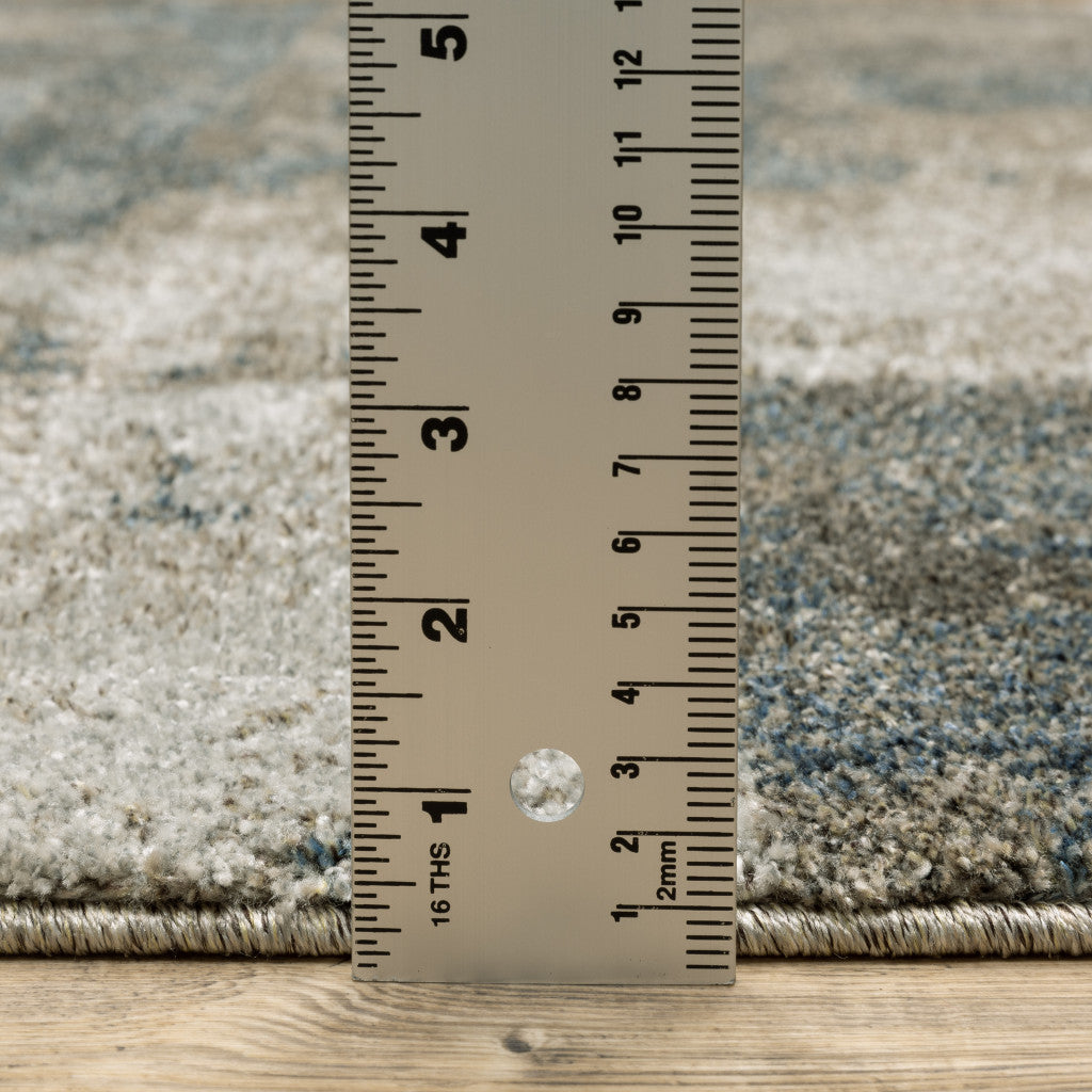10' X 13' Teal Blue Grey Tan And Beige Geometric Power Loom Stain Resistant Area Rug