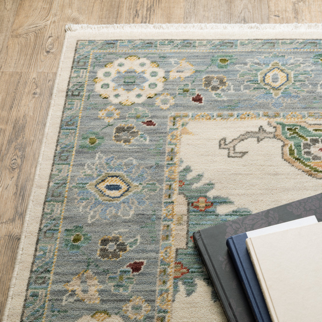 2' X 6' Ivory Blue Grey Teal Gold Green And Rust Oriental Power Loom Stain Resistant Runner Rug With Fringe