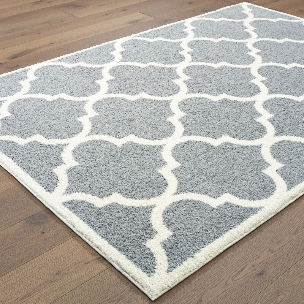 6' X 9' Grey And Ivory Geometric Shag Power Loom Stain Resistant Area Rug