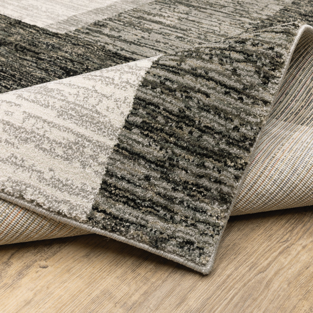 2' X 8' Charcoal Grey And Ivory Geometric Power Loom Stain Resistant Runner Rug