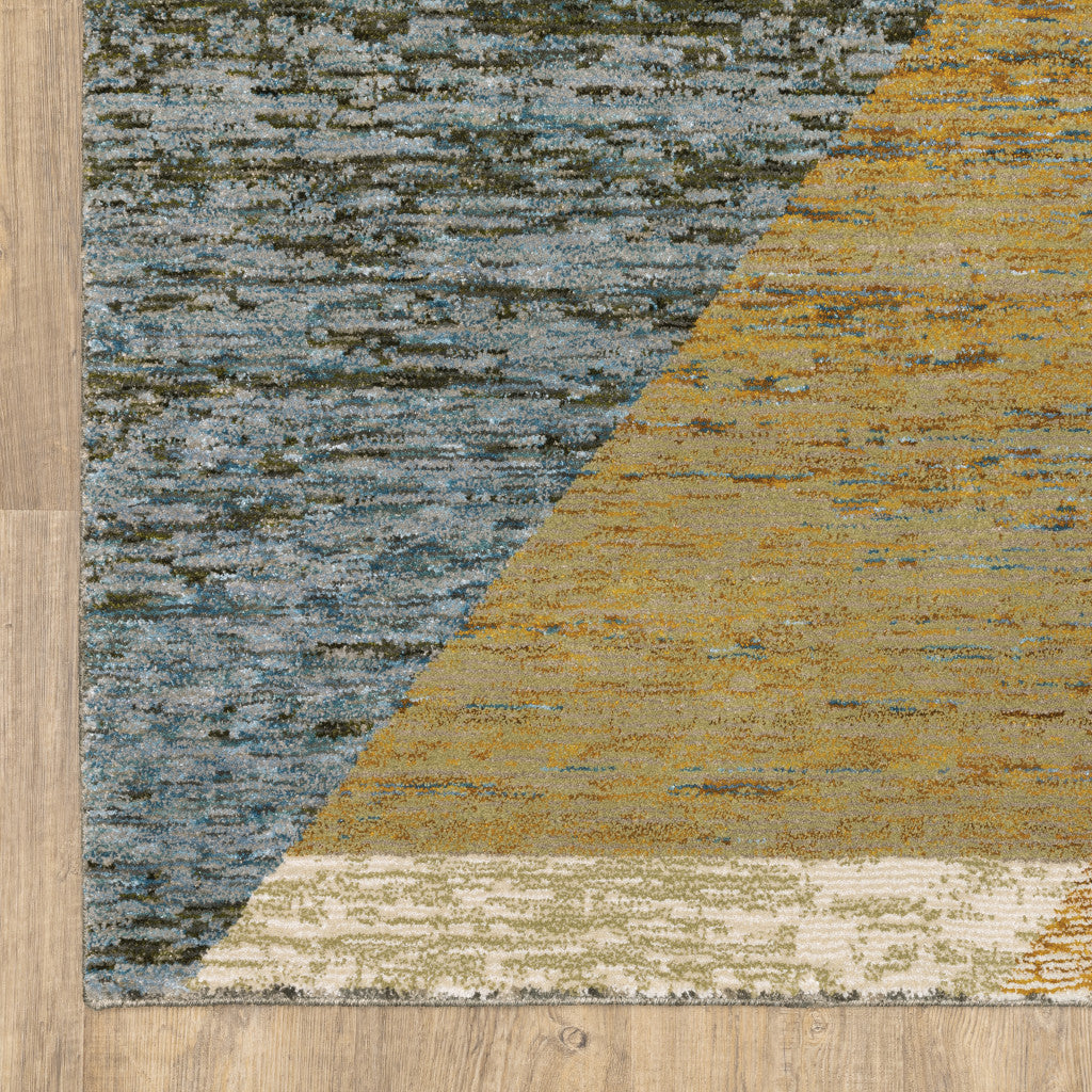 5' X 7' Gold Blue Green Rust Beige Purple And Teal Geometric Power Loom Stain Resistant Area Rug