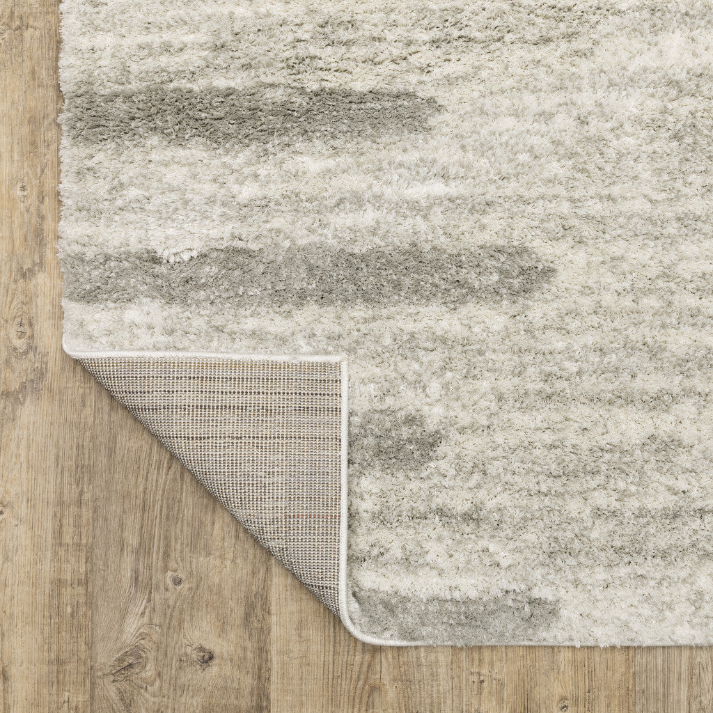 8' X 11' Ivory And Grey Geometric Shag Power Loom Stain Resistant Area Rug