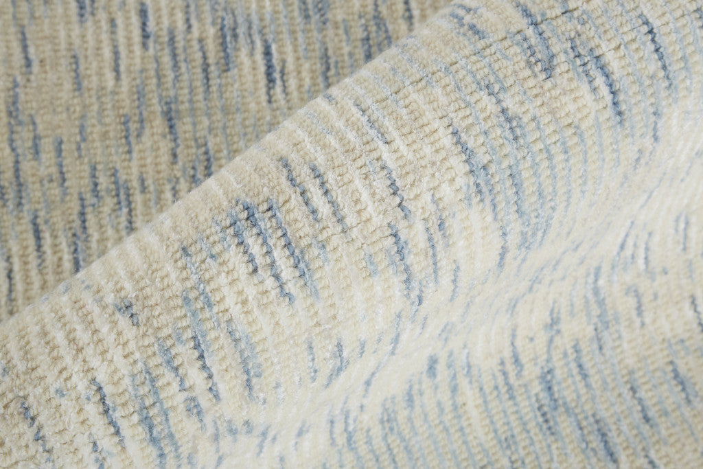 8' X 11' Ivory And Tan Abstract Hand Woven Area Rug