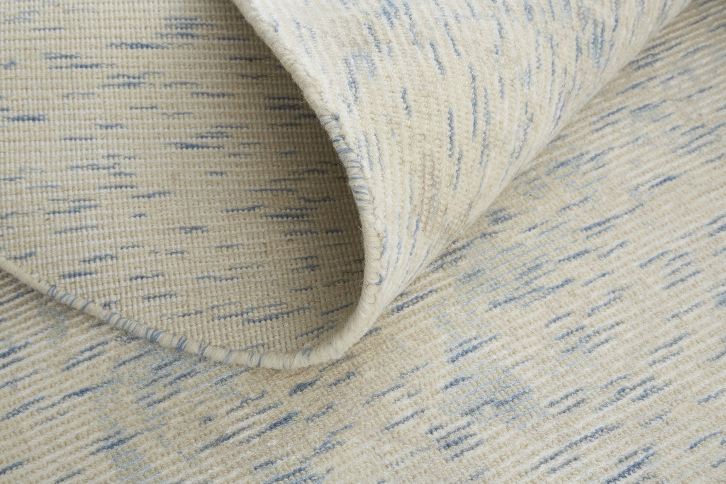 8' X 11' Ivory And Tan Abstract Hand Woven Area Rug