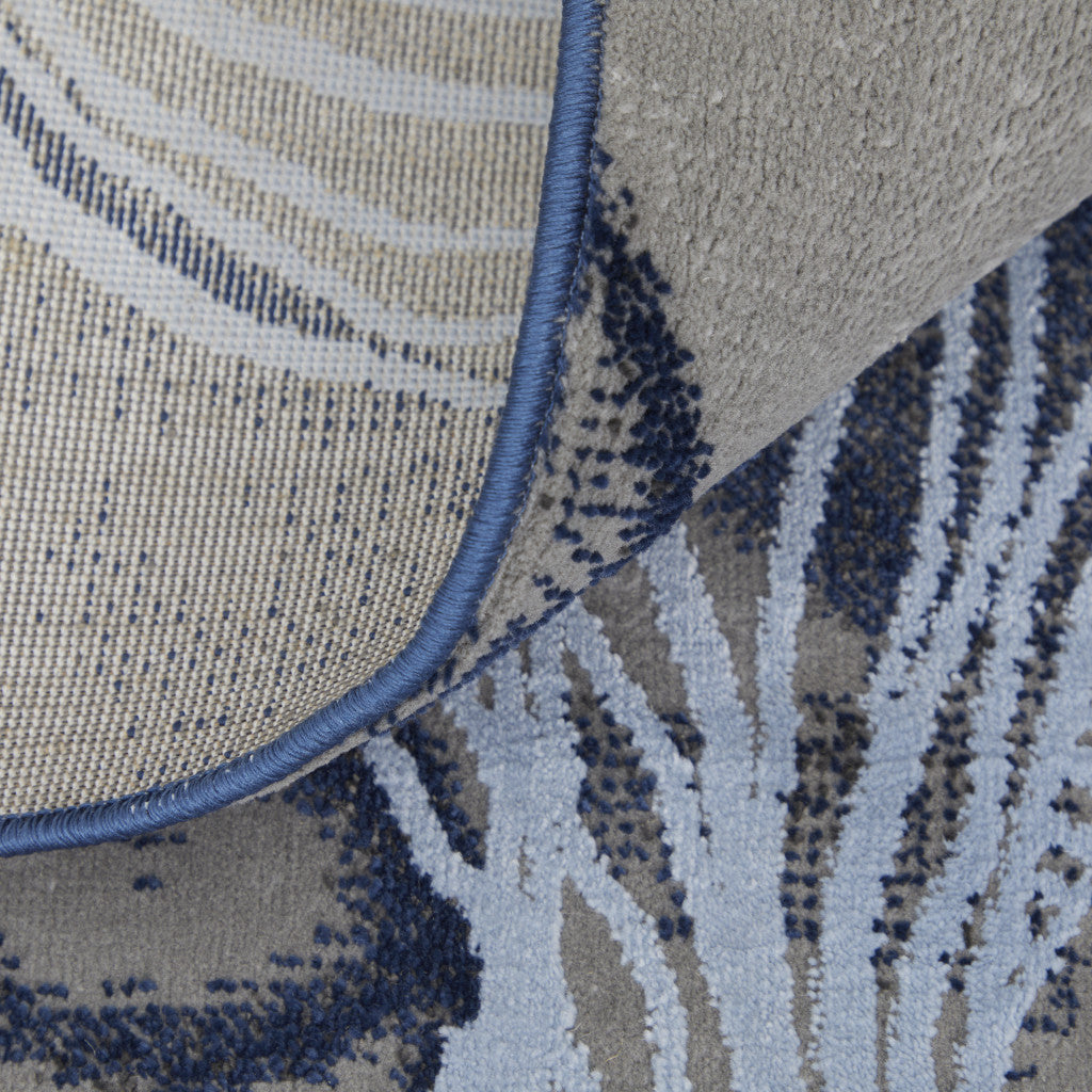 5' X 7' Blue Gray And Ivory Abstract Power Loom Stain Resistant Area Rug