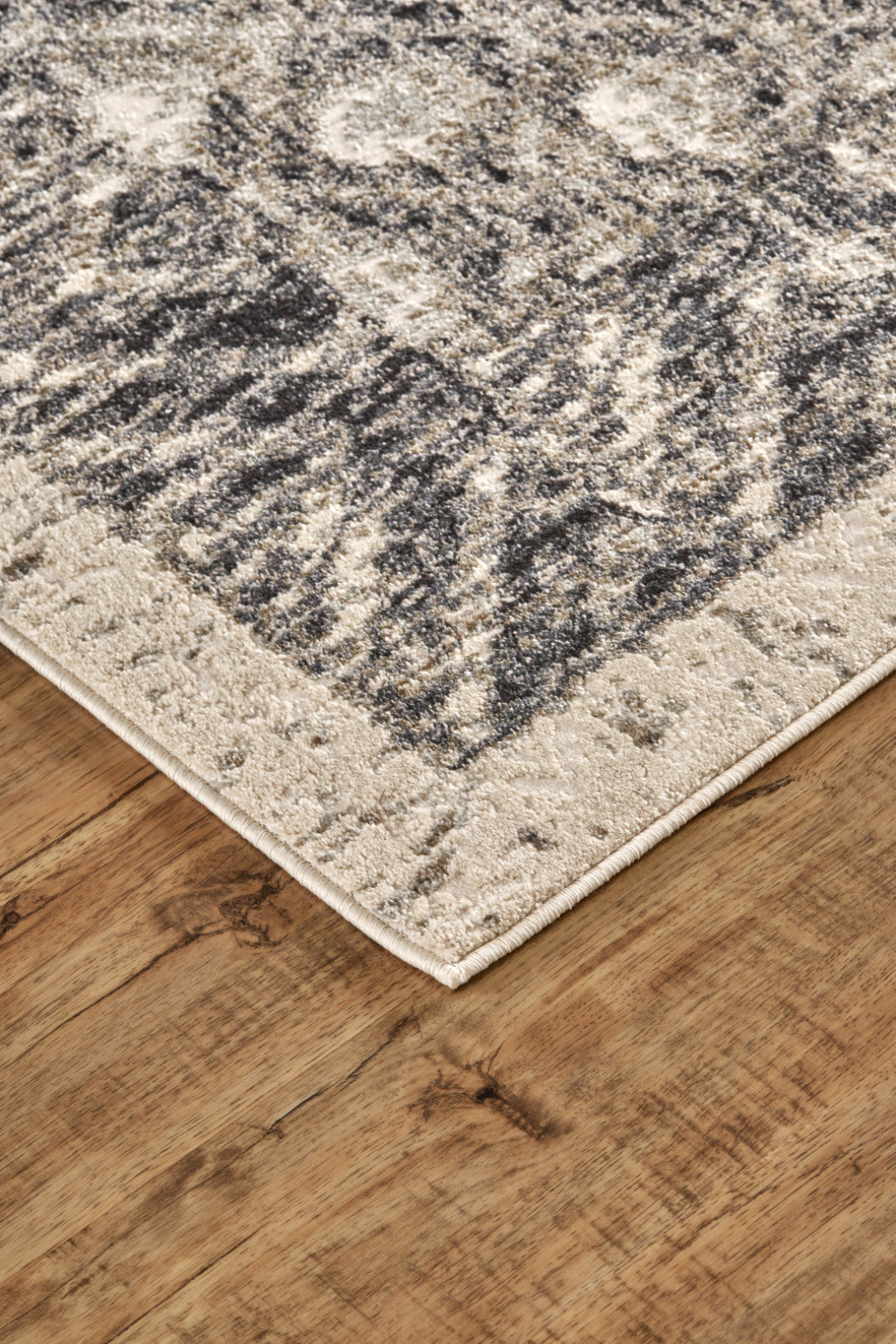 4' X 6' Ivory Black And Taupe Abstract Stain Resistant Area Rug