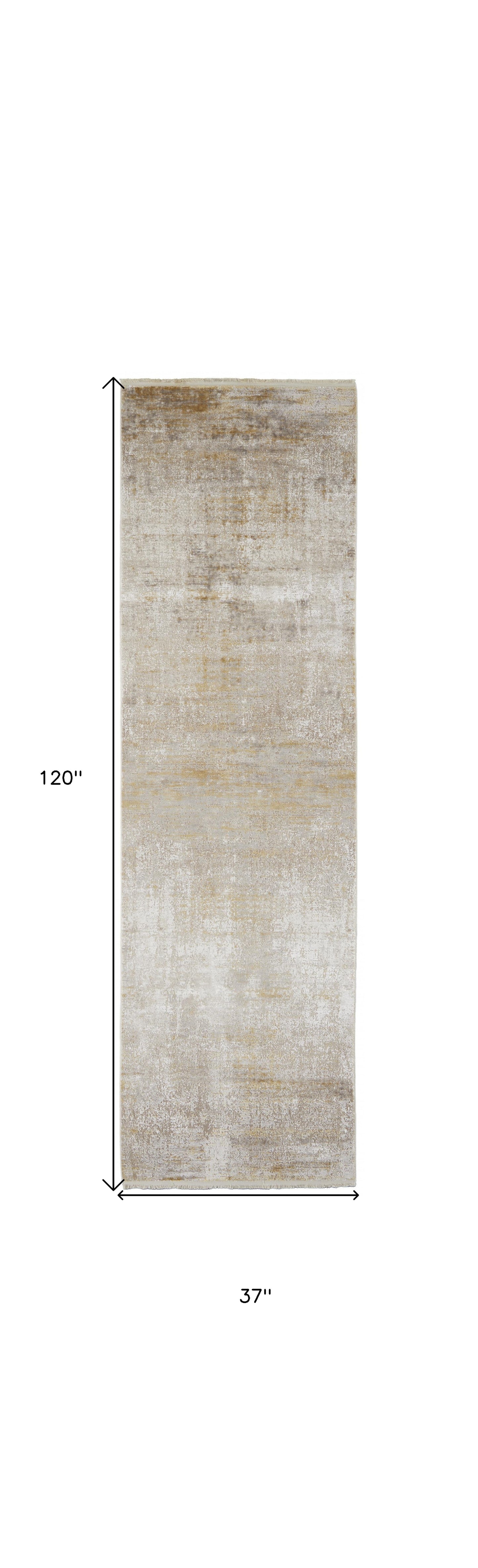 3' X 5' Taupe Ivory And Gold Abstract Power Loom Distressed Area Rug With Fringe