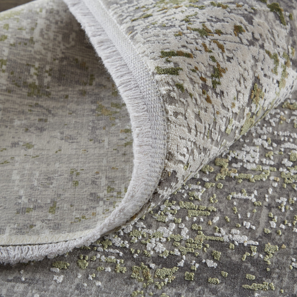 5' X 8' Green Gray And Ivory Abstract Area Rug With Fringe