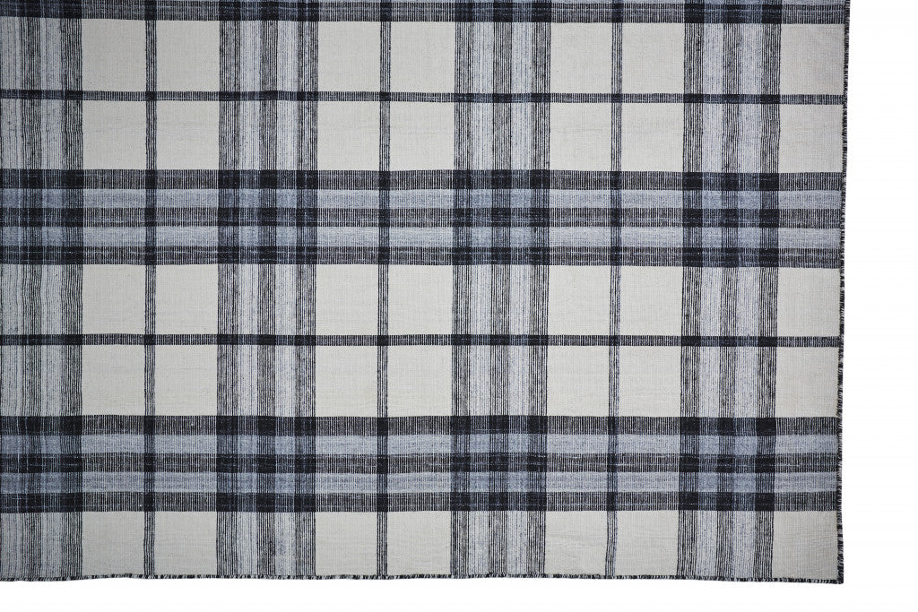 5' X 8' Ivory Blue And Black Abstract Hand Woven Stain Resistant Area Rug
