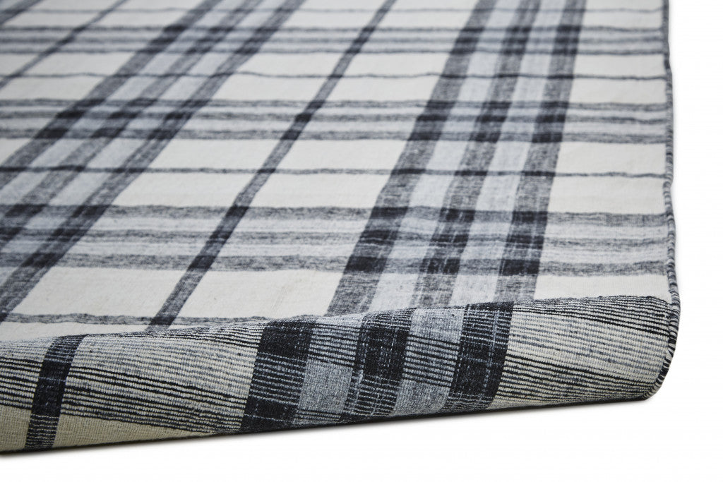 5' X 8' Ivory Blue And Black Abstract Hand Woven Stain Resistant Area Rug
