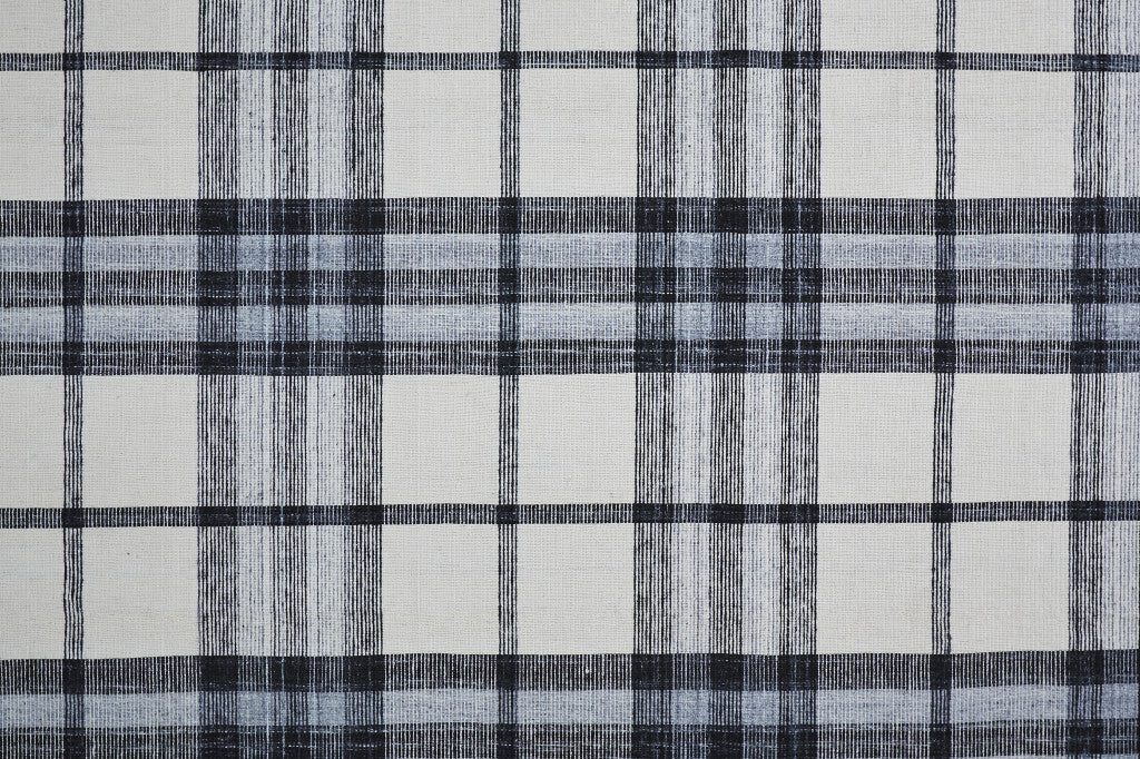5' X 8' Ivory Blue And Black Abstract Hand Woven Stain Resistant Area Rug