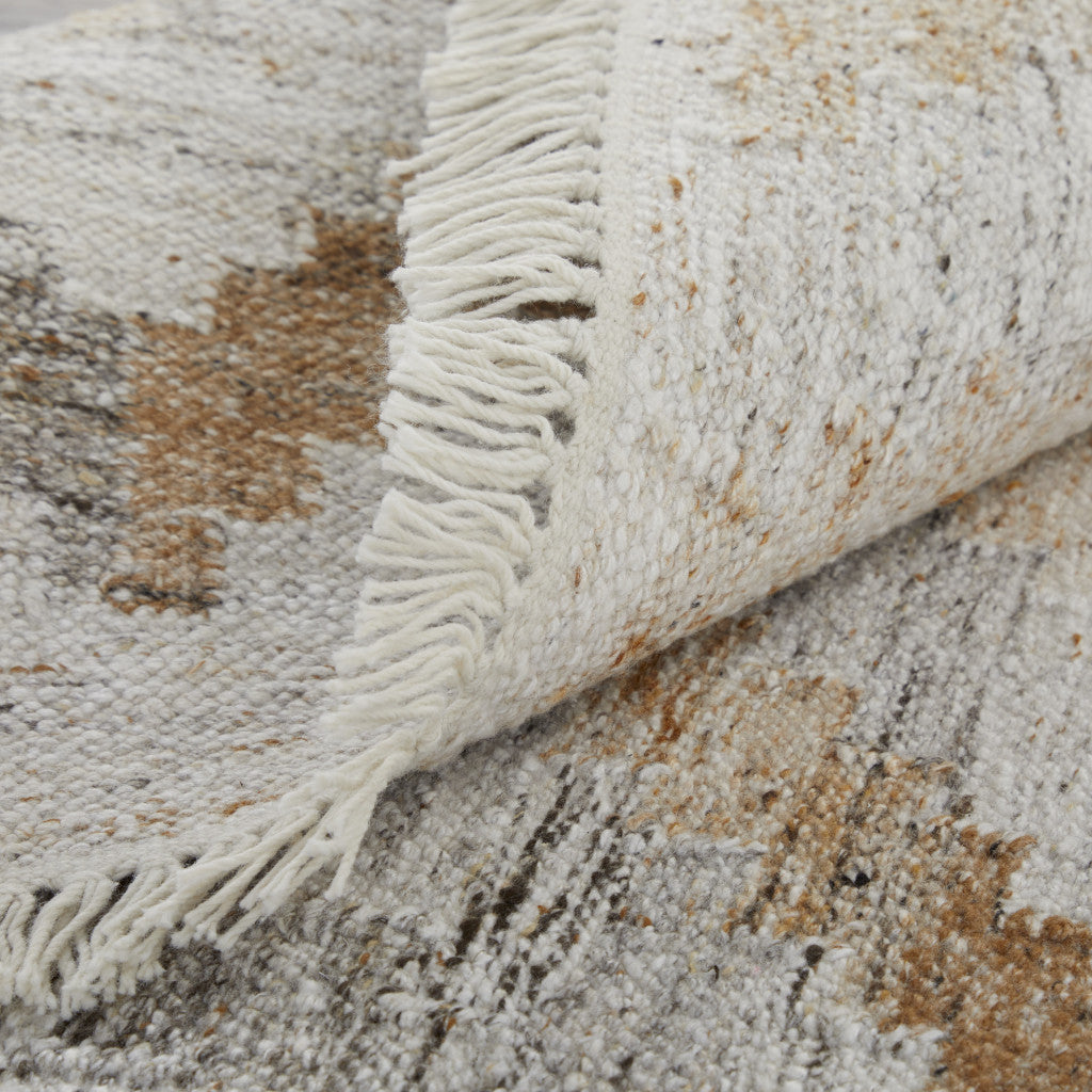 4' X 6' Ivory Gray And Tan Geometric Hand Woven Stain Resistant Area Rug With Fringe