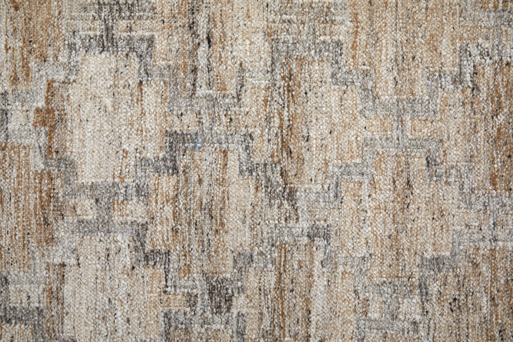 5' X 8' Tan Gray And Ivory Geometric Hand Woven Stain Resistant Area Rug With Fringe