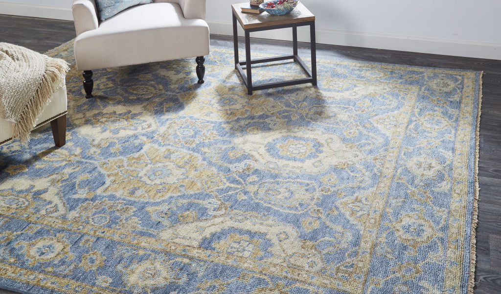 8' X 10' Blue Gold And Tan Wool Floral Hand Knotted Stain Resistant Area Rug With Fringe