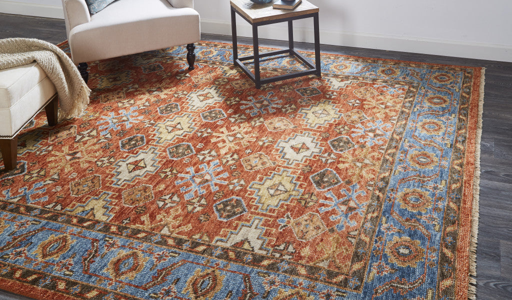 5' X 8' Red Blue And Orange Wool Floral Hand Knotted Stain Resistant Area Rug With Fringe