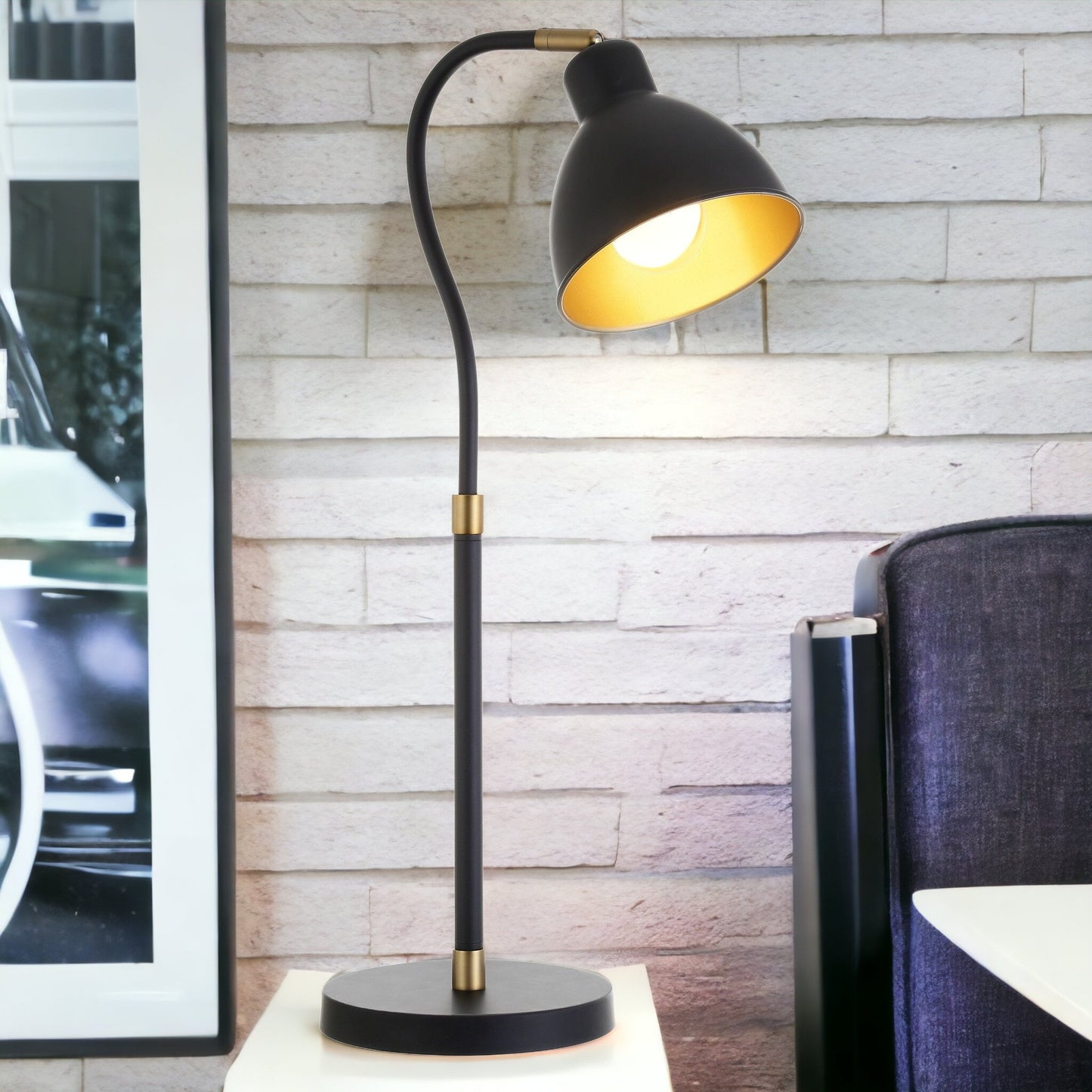 25" Black and Gold Metal Arched Table Lamp With Black Dome Shade