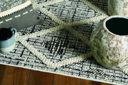 5' X 8' Charcoal Geometric Diamond Indoor Area Rug With Fringe