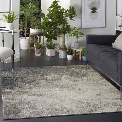 5' Gray And Ivory Round Abstract Power Loom Area Rug