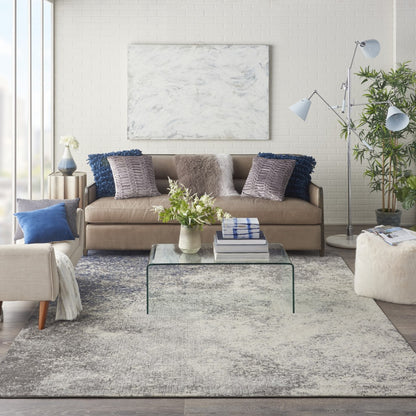 5' Gray And Ivory Round Abstract Power Loom Area Rug