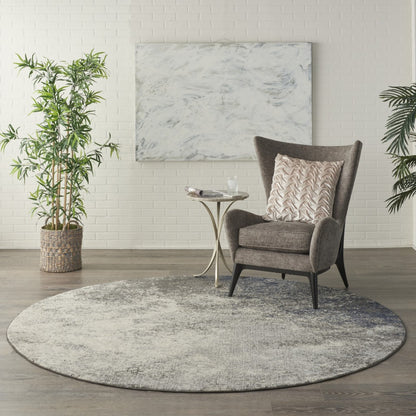 5' Gray And Ivory Round Abstract Power Loom Area Rug