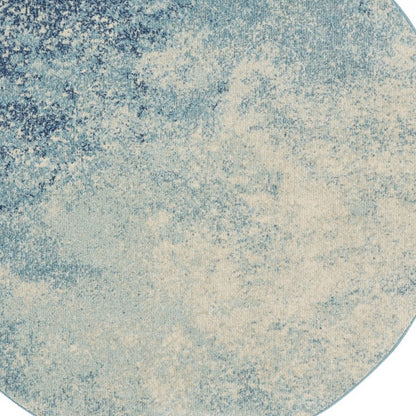 5' X 7' Ivory And Blue Abstract Power Loom Area Rug