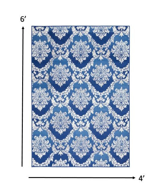 4' X 6' Blue And Ivory Floral Dhurrie Area Rug