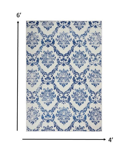 4' X 6' Blue And Ivory Floral Dhurrie Area Rug