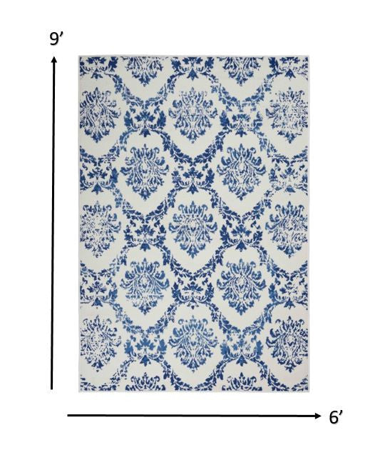 4' X 6' Blue And Ivory Floral Dhurrie Area Rug