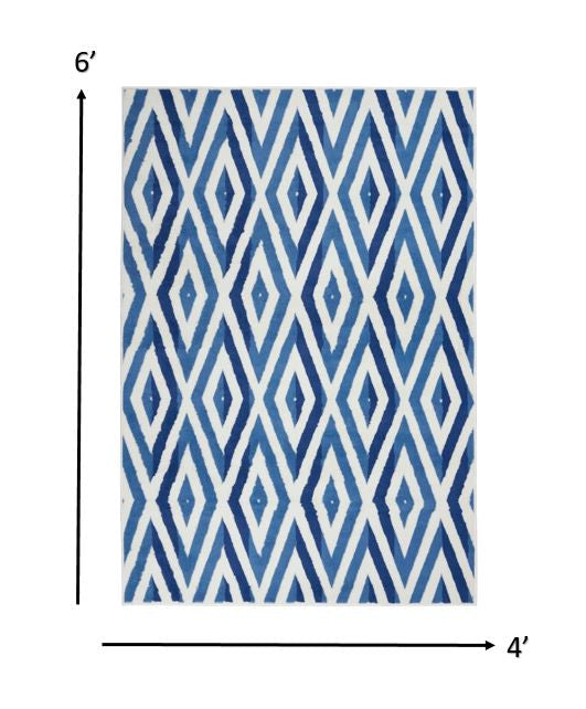 6' X 9' Blue And Ivory Geometric Dhurrie Area Rug
