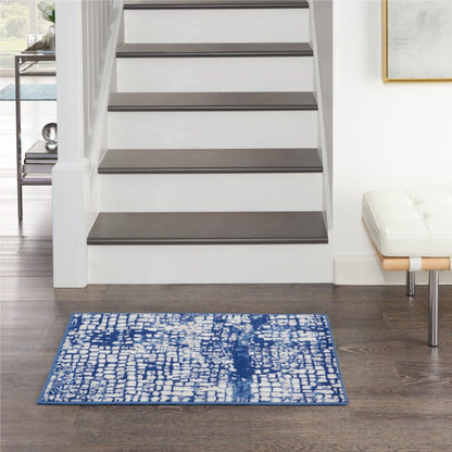 5' X 7' Blue And Ivory Abstract Dhurrie Area Rug