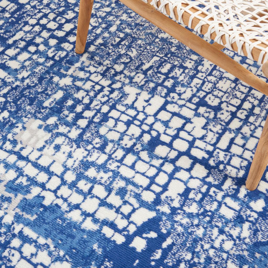 5' X 7' Blue And Ivory Abstract Dhurrie Area Rug
