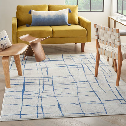 4' X 6' Blue And Ivory Abstract Dhurrie Area Rug