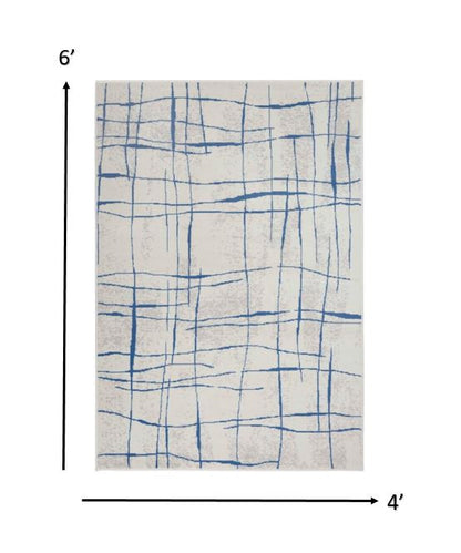4' X 6' Blue And Ivory Abstract Dhurrie Area Rug