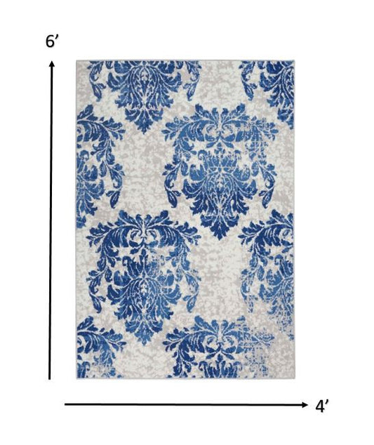 4' X 6' Blue And Ivory Floral Dhurrie Area Rug