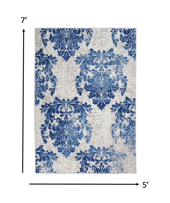 4' X 6' Blue And Ivory Floral Dhurrie Area Rug